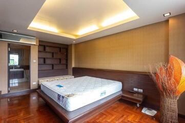 Master bedroom with modern design and wooden flooring