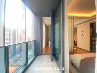 Modern high-rise bedroom with city view