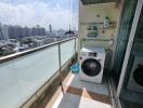 Balcony with a washing machine and view of the city