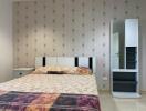 Modern bedroom with a double bed and wardrobe mirror