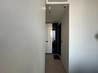 View of a hallway with a closet and doorway