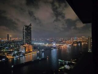 city skyline at night with river view