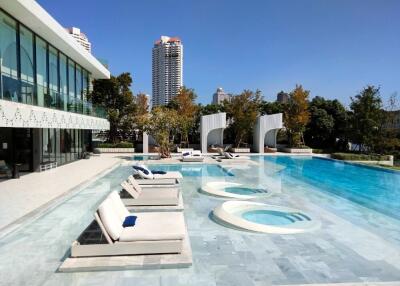 Luxurious outdoor pool area with lounge chairs and modern design