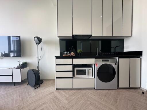 Modern kitchen with white cabinets and appliances