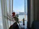 Living room with a view of the river and cityscape