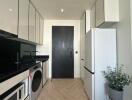 Modern kitchen with appliances and black and white theme