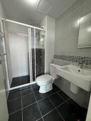 Modern bathroom with shower and sleek fixtures