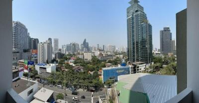 City view from apartment balcony