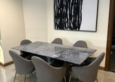 Modern dining room with marble table and abstract art