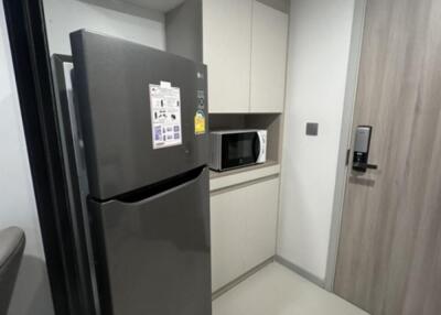 Modern kitchen with refrigerator and microwave