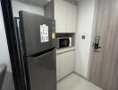 Modern kitchen with refrigerator and microwave