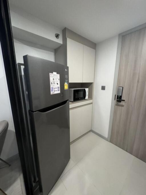 Modern kitchen with refrigerator and microwave