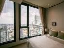 Modern bedroom with a large window offering a city view