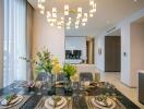 Elegant dining area with modern chandelier and table settings