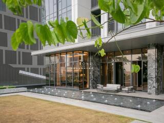 Modern building exterior with patio and water feature