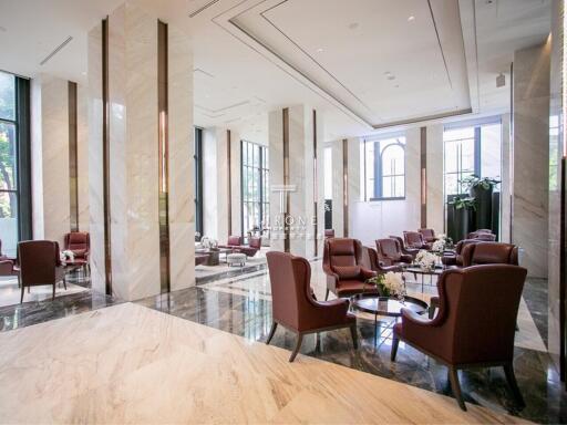 Spacious lobby with elegant seating area and large windows