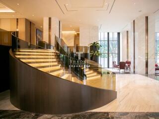 Elegant lobby with a curved staircase