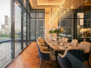 Elegant dining room with large floor-to-ceiling windows