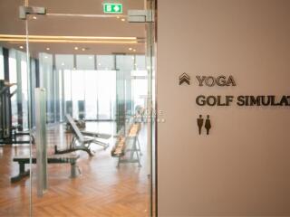 Fitness area with glass doors and exercise equipment