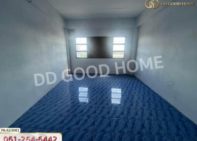 Empty room with blue tile flooring