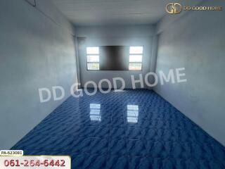 Empty room with blue tile flooring