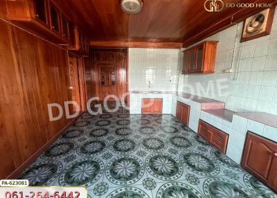 Spacious kitchen with wooden cabinets and unique tile flooring