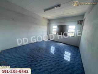 Spacious bedroom with blue tiled flooring