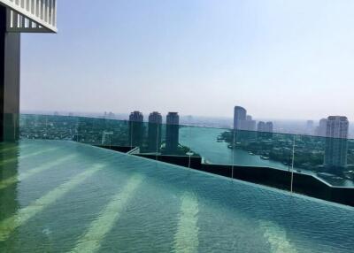 Rooftop infinity pool with city and river view