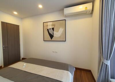 Bedroom with modern decor and air conditioner