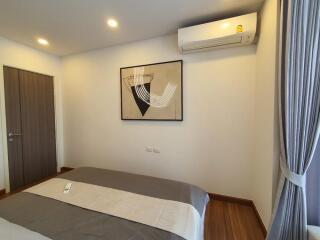 Bedroom with modern decor and air conditioner