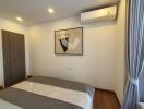 Bedroom with modern decor and air conditioner