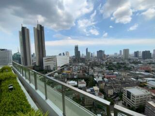 Cityscape view from a high-rise building balcony