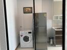 Compact kitchen with refrigerator and washing machine