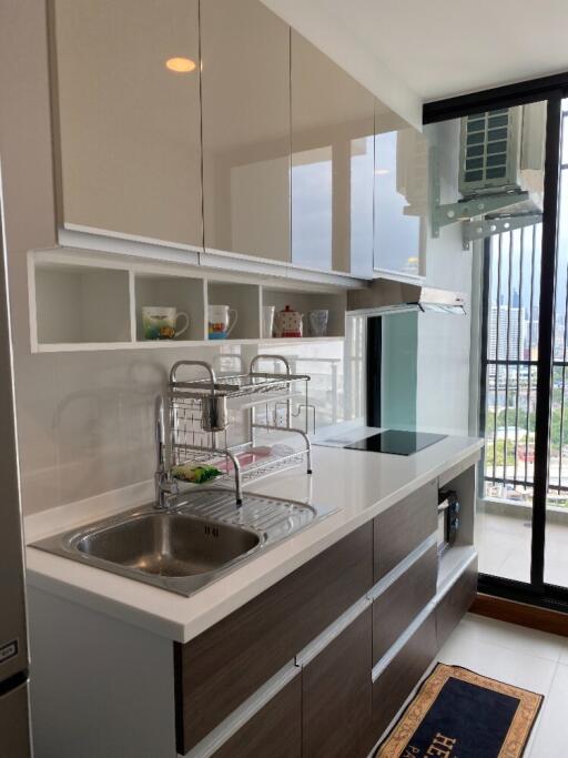 modern kitchen with built-in cabinets and city view