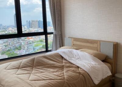 Cozy bedroom with a city view