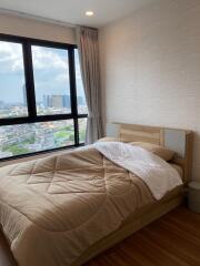 Cozy bedroom with a city view