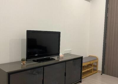 Minimalist living room with TV and cabinet