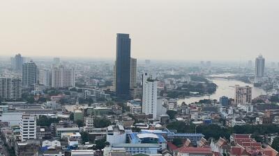 Panoramic city view showcasing high-rise buildings and a river