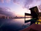 Stunning rooftop pool with cityscape view at sunset