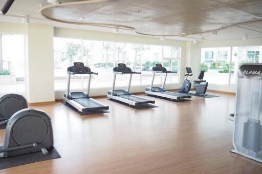 Spacious and well-lit fitness center with modern exercise equipment