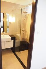 Modern bathroom with glass shower door and vanity sink