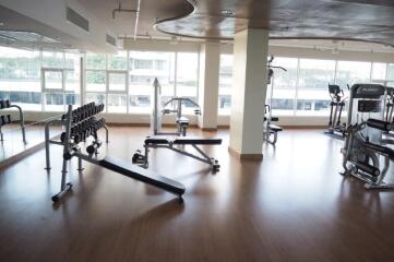 Spacious gym area with various exercise equipment