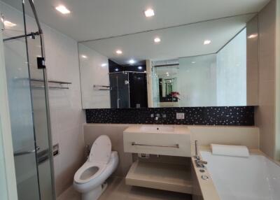 Modern bathroom with large mirror and glass shower