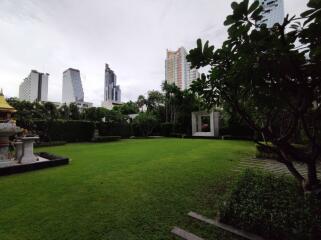 Spacious garden with city backdrop