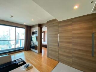 Modern apartment living room with wooden paneling and large window