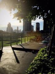 City skyline view from outdoor space with greenery