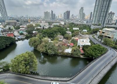 High-rise cityscape with road and river