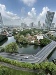 High-rise cityscape with road and river