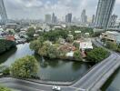 High-rise cityscape with road and river