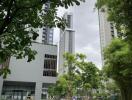 View of modern buildings with greenery and a pathway